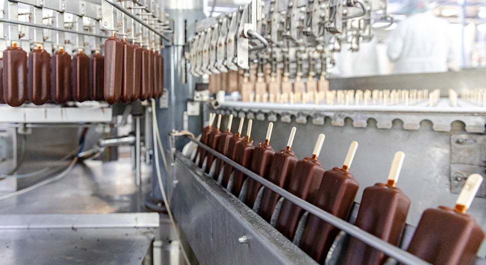 Ice cream production line with chocolate-coated bars highlighting allergen control challenges in food manufacturing