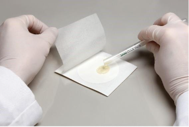 A person holding a thermometer – AI-generated content may be incorrect.