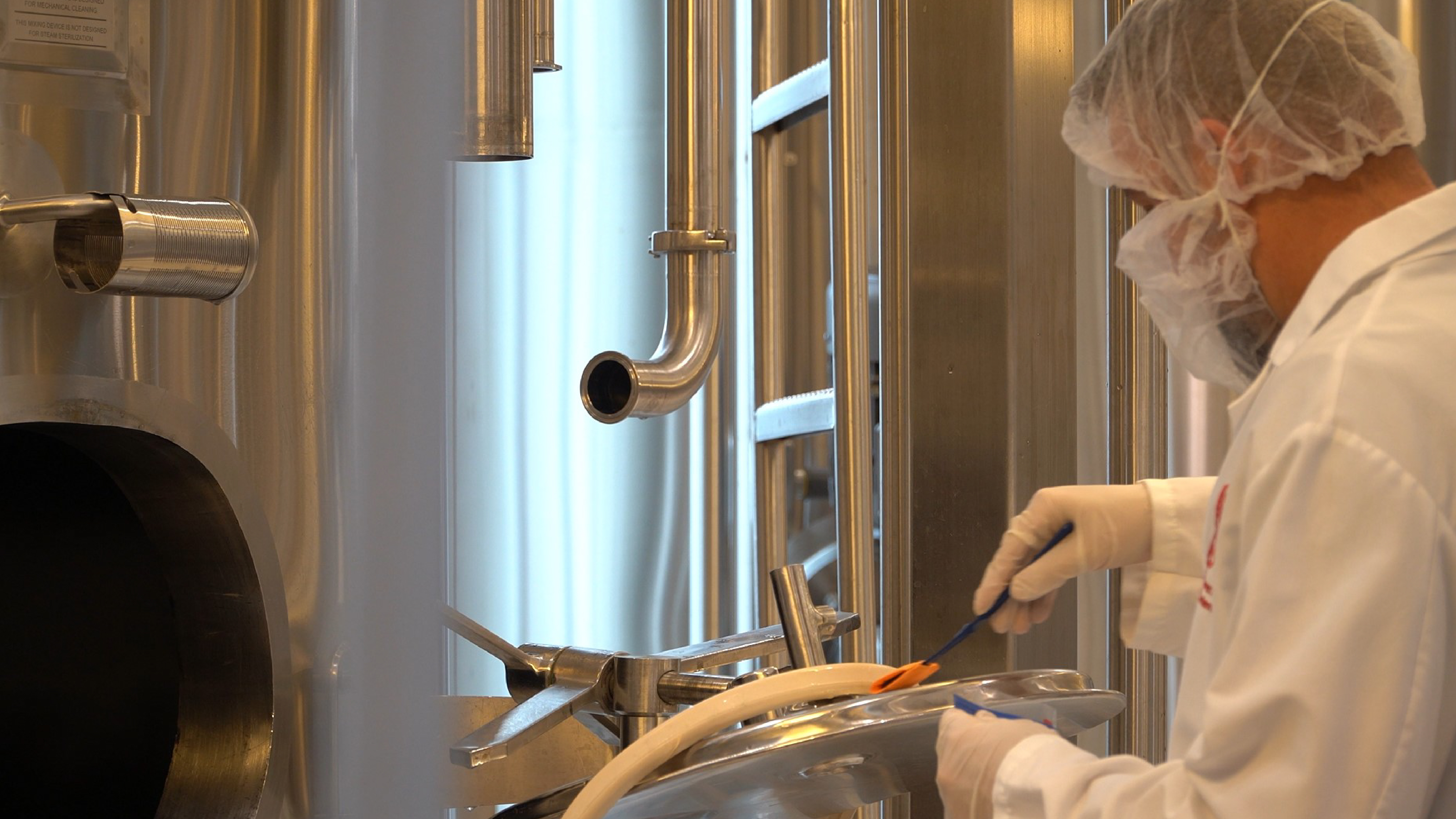 Food safety technician swabbing equipment