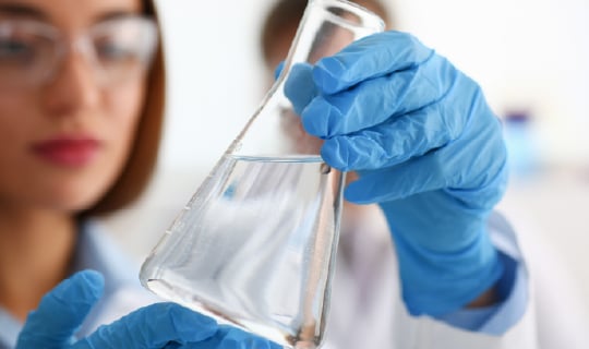 scientist with beaker