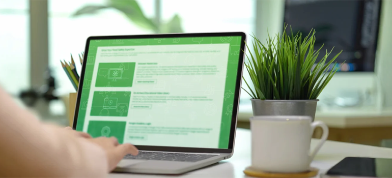 Image of laptop on desk with Neogen Academy on the screen