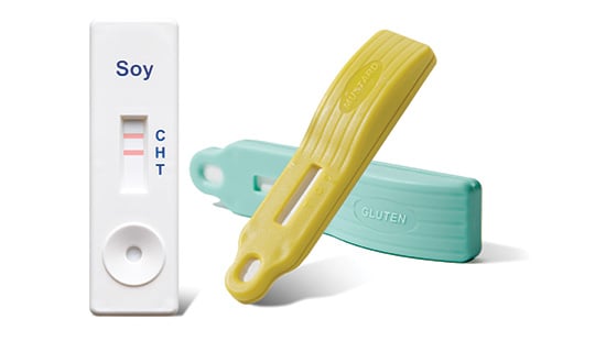 Lateral flow allergen test devices used for rapid on-site detection of soy and gluten residues in food production environments.