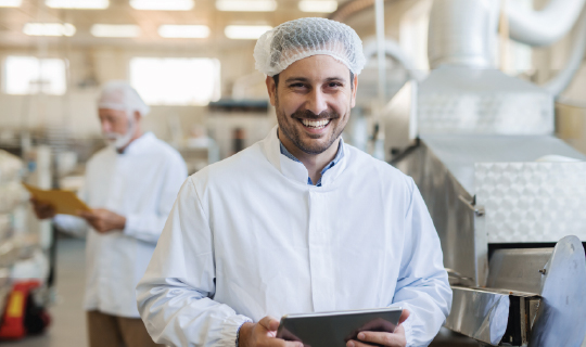 Food processing worker using environmental monitoring data to manage safety and quality.