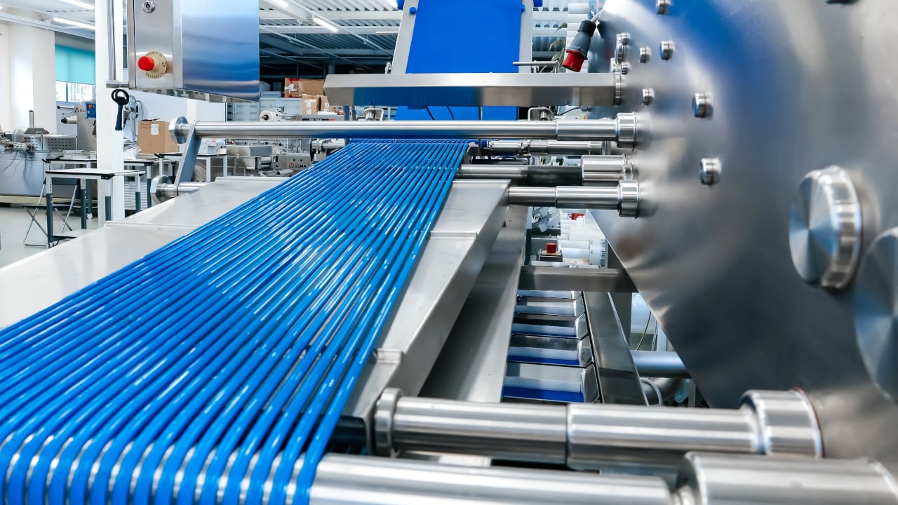 Food and beverage manufacturing facility conveyor after cleaning and sanitation.